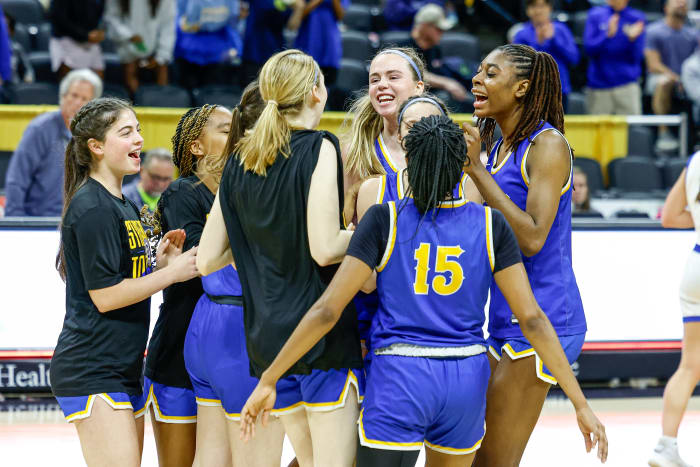 John Burroughs celebrates its Missouri Class 5 girls basketball semifinal win.